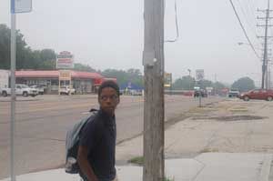 Boy waits for school bus in Dellwood